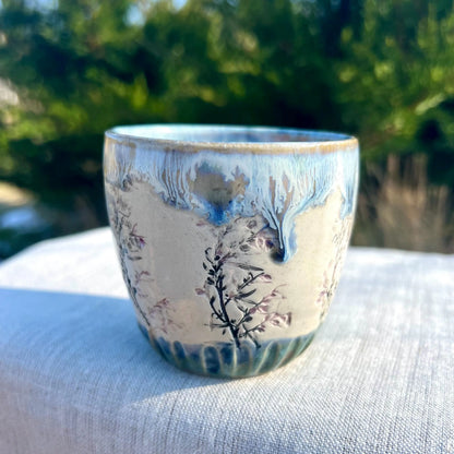 Glāzīte ar ziediem